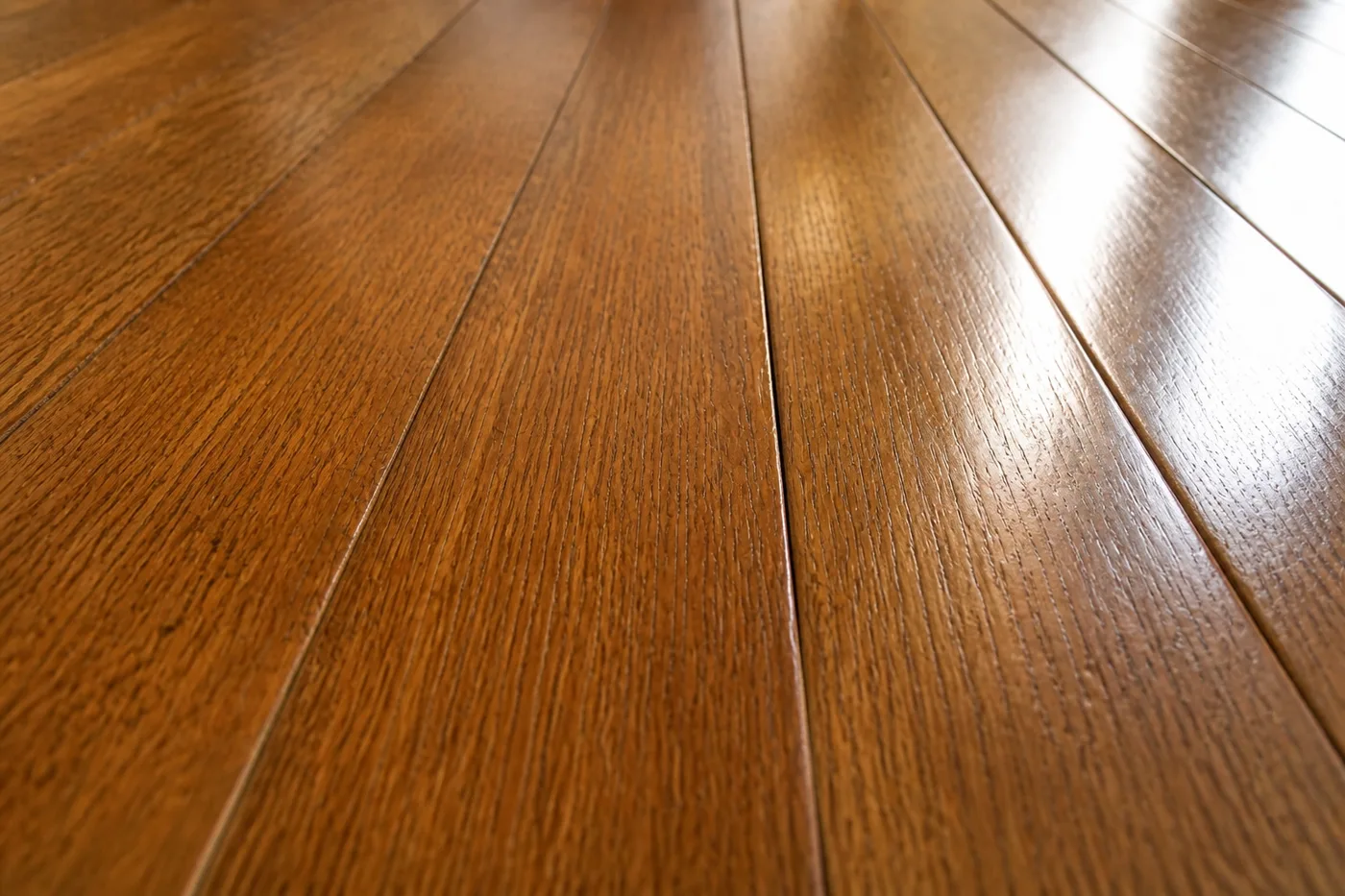 The same boards close up after filling and refinishing, with only fine hairline joints left